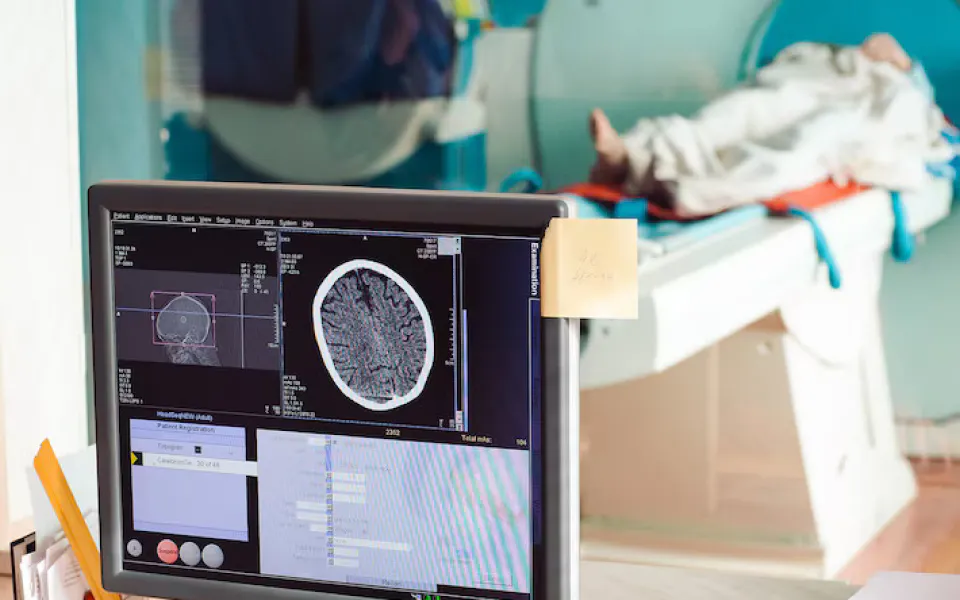Tablet displaying medical imaging reports with doctor interacting, illustrating DICOM standards in healthcare.