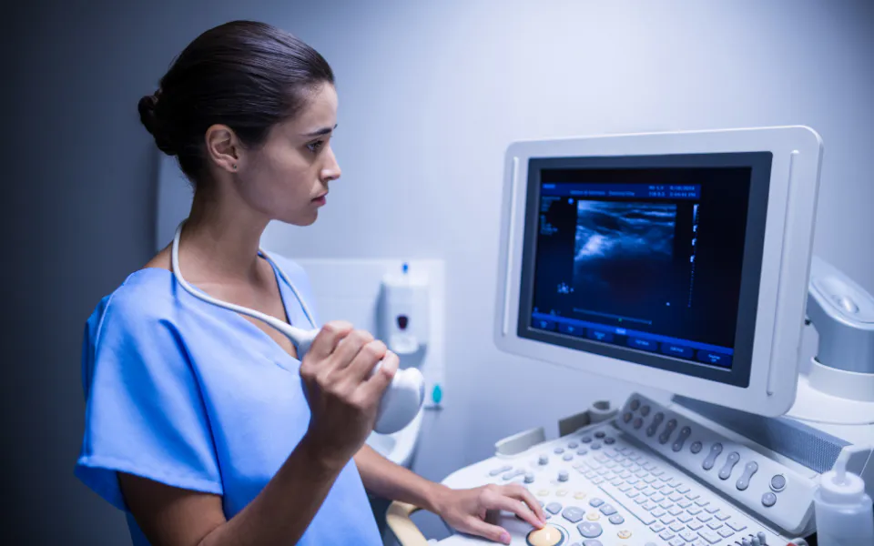 Doctor observing medical imaging scans on PC monitor, representing the future of medical imaging technology.